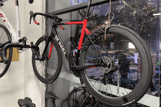 On the influence of aerodynamic posture on cycling speed